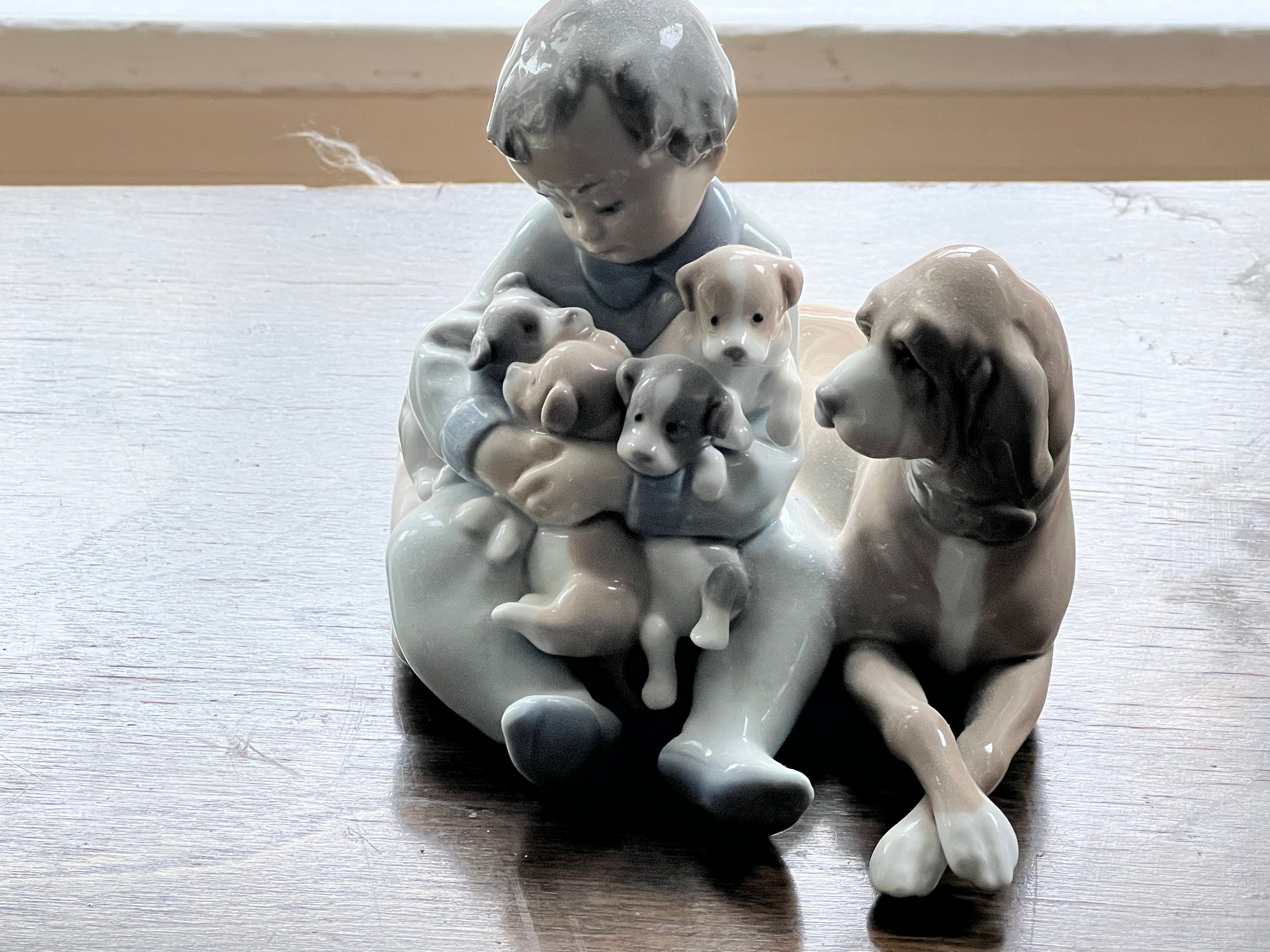 Lladro boy sitting with dog deals