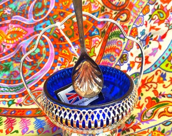 Queen Anne chrome plate and cobalt blue glass sugar bowl with silver-plated spoon, as new with tag, made in England circa 1970.