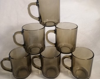 Vintage set of 6 Arcoroc smoked glass tea or coffee mugs. Hard-wearing moulded tempered utility glass made in France circa 1980s.