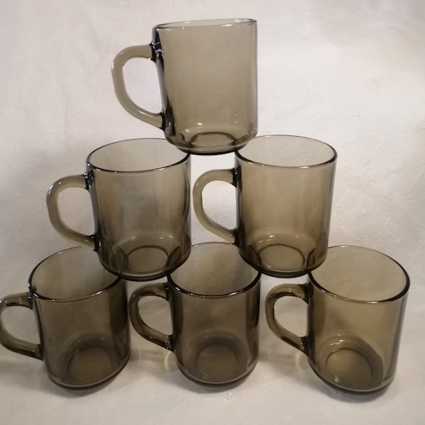 Vintage set of 6 Arcoroc smoked glass tea or coffee mugs. Hard-wearing moulded tempered utility glass made in France circa 1980s.