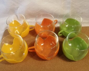 Mid-century set of three Dutch Combi Cups in citrus colours, lime lemon & orange, glass and plastic picnic drinkware circa 1960s or 1970s.