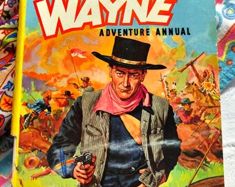 John Wayne Adventure Annual, published in 1953, good readable copy with some spine damage.
