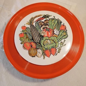 Vintage orange-painted lacquer snack, hors d&#39;oeuvres, crudites platter, decorated with a plethora of vegetables, made in Japan circa 1970s.