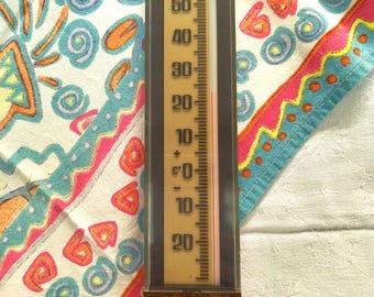 Large vintage car thermometer, black and faux wood plastic with clear lucite cover, Celsius/centigrade circa 1970s.