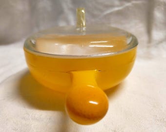 Stylish vintage "Glasbake" brand yellow-enamelled milk glass pyrex ramekin with handle and glass lid. Made in USA circa 1960s or 1970s.