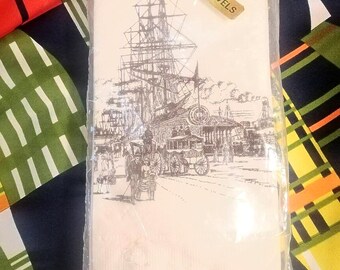 Vintage packet of 12 Deeko paper Hand Towels, cream printed with brown image of sailing ship & dockside scene, made in Australia circa 1970s