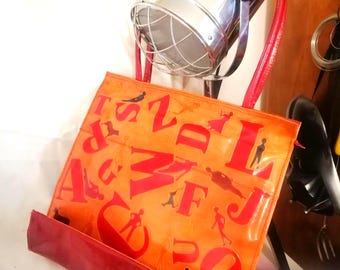 Vintage red-lined leather shopping bag/tote with colourful embossed figures of humans & animals, dog cat deer sheep duck, circa 1980s/90s.