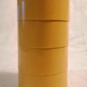 Set of 4 moulded beach sand-coloured plastic stackable vintage egg cups, mid-century modern kitchen tableware or breakfastware circa 1970s.