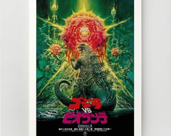 May include: A framed poster featuring a vibrant illustration of Godzilla facing a large, red, floral-like creature. The poster has Japanese text and a green and yellow color scheme, with a white border.
