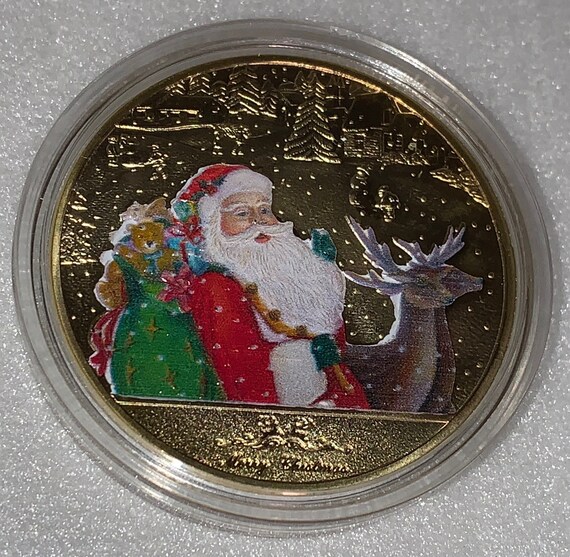 メリークリスマスとサンタクロースがプレゼントを届けるコイン 金 