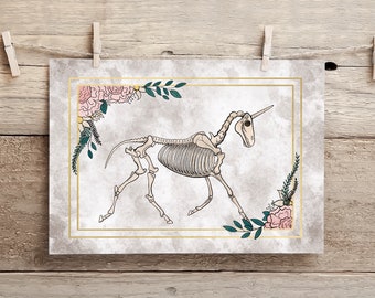 May include: A white unicorn skeleton with a gold horn and floral accents. The skeleton is surrounded by pink and white flowers and green leaves. The background is a light gray watercolor wash.