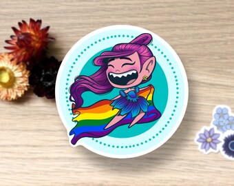 May include: A sticker featuring a cartoon character with pink hair and a rainbow flag. The character is smiling and wearing a blue flower crown. The sticker is on a white background with a blue circle around the character.