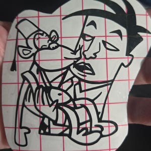 May include: Black and white cartoon sticker featuring a man and a mouse. The man has a stern expression, and the mouse is wearing a fez. The sticker is on a white background with a red grid pattern.