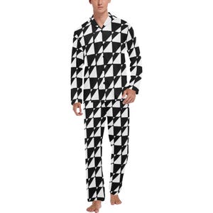 May include: A two-piece pajama set featuring a black and white geometric triangle pattern. The long-sleeved top has a collared neckline and button-down closure. The matching pants have a relaxed fit.