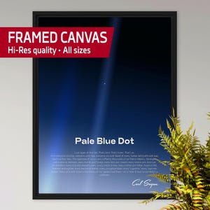 May include: Framed canvas print featuring the image of the 'Pale Blue Dot'. The artwork displays a dark blue and black background with a bright white dot and text. The text includes the title, a quote by Carl Sagan, and the words 'FRAMED CANVAS' and 'Hi-Res quality • All sizes'.