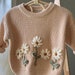 see more listings in the Embroidered Knit Sweater section