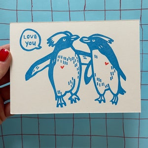 Penguins in love Postcard image 1