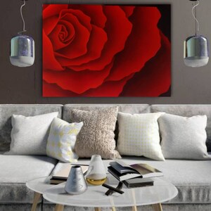 May include: A close-up of a red rose with a soft, velvety texture. The petals are arranged in a spiral pattern, creating a sense of depth and dimension. The rose is a symbol of love, beauty, and passion.