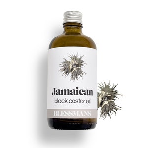 May include: A brown glass bottle with a silver lid, labeled "Jamaican black castor oil" and "Blessmans". The bottle is sitting on a white background.