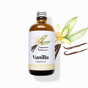 May include: A brown glass bottle with a silver lid and a white label that says "Vanilla Fragrance Oil" and features a drawing of a vanilla bean and flower. The bottle is on a white background.