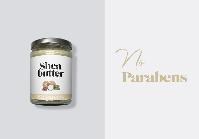 May include: A glass jar of shea butter with a white label that says "Shea butter" and a drawing of shea nuts. The label also says "Blessmans". The background is light gray. The text "No Parabens" is written in gold on a white background.