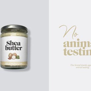 May include: A glass jar of shea butter with a white label that says "Shea butter" and has a drawing of shea nuts. The label also says "Blessmans". The background is light gray. The text "No animal testing. Our brand stands against animal testing." is in the background.