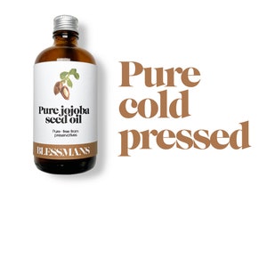 May include: A brown glass bottle with a silver lid, labeled "Pure jojoba seed oil" and "Blessmans". The bottle is sitting on a white background with the text "Pure cold pressed" in brown letters.