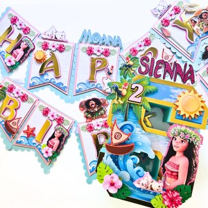 May include: A colorful birthday banner and cake topper set featuring characters and elements from the animated film Moana. The banner spells out "Happy Birthday Sienna" with decorative accents, and the cake topper includes a wave, boat, and Moana characters.