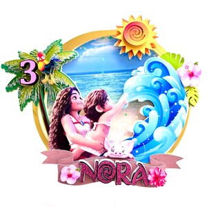 May include: A 3D cake topper featuring Moana and Maui from the Disney movie Moana. The topper is decorated with a tropical beach scene, a palm tree, a sun, a wave, and a pig. The name "Nora" is written in pink glitter on a brown banner.