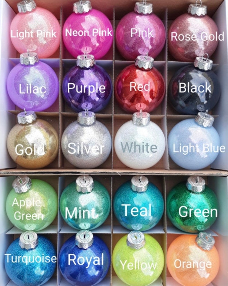 May include: A set of 18 round Christmas ornaments with glitter finishes in various colors, including light pink, neon pink, pink, rose gold, lilac, purple, red, black, gold, silver, white, light blue, apple green, mint, teal, green, turquoise, royal, yellow, and orange.