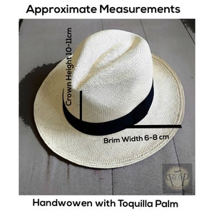 May include: A cream-colored, handwoven hat made from toquilla palm, featuring a black band. The crown height is approximately 4-4.3 inches, and the brim width is 2.4-3.1 inches. The text reads "Approximate Measurements" and "Handwoven with Toquilla Palm".