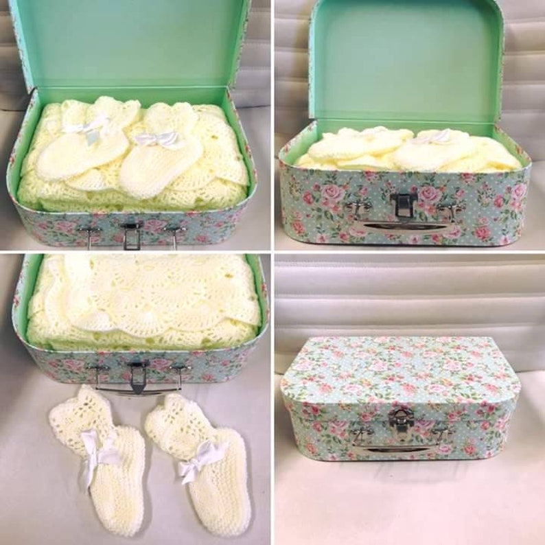 Baby blanket and bootees in a keepsake case