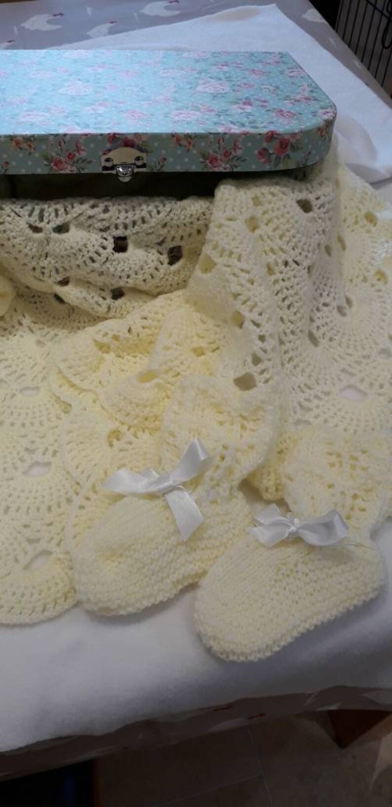 Baby blanket and bootees in a keepsake case