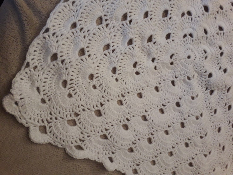 Baby blanket and bootees in a keepsake case