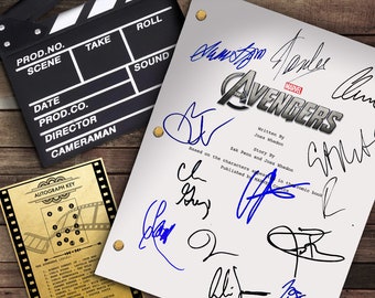 May include: A white clapperboard with the title "Avengers" and the names of the writers and cast members in blue ink. The clapperboard is on a wooden surface.