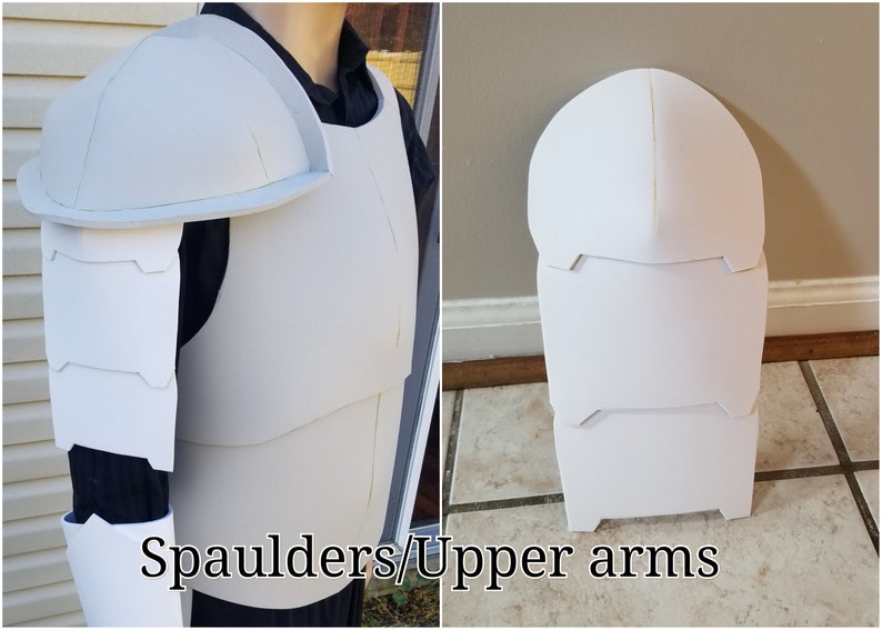 May include: White foam armor pieces for a costume. The pieces are for the shoulders and upper arms. The pieces are laid out flat and show the shape and design.
