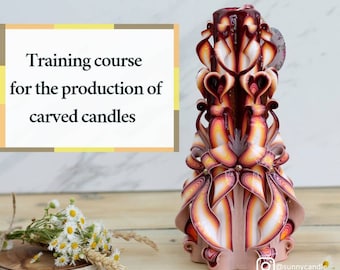 May include: A training course for the production of carved candles is advertised. The image shows a large, intricately carved candle with a red, white, and orange color scheme. The candle is on a wooden surface.