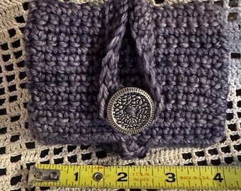 Handmade crocheted mini bag.  3” x 4”, made from merino wool, with 3 slots inside, pen and notebook included