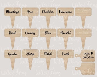 May include: Wooden cheese markers with various cheese names like Manchego, Brie, and Cheddar. The markers are light brown with a rectangular top and a pointed base. The image also includes a cutting board-shaped marker with the text "cheers & charcuterie".
