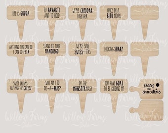 May include: A set of 14 laser cut wooden cheese markers with funny puns and sayings. The markers are designed for charcuterie boards and wedding favors. The text on the markers includes "Life is Gouda", "To Ravarti and to Hold", "Were Cheddar Together", "Once in a Bleu Moon", "Anything You Can Do I Can Do Feta", "Stand by Your Manchego", "Were Soul Swiss-Ters", "Looking Sharp", "Sweet Dreams Are Made of Cheese", "Who Am I to Dis-a-Brie?", "Do the Munster Mash", "You Have Goat to Be Kidding Me", and "Cheers Charcuterie".