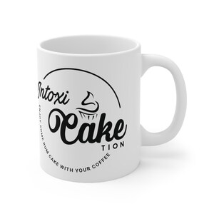 Intoxi-Cake-Tion left hand Ceramic Mug 11oz logo facing out image 4