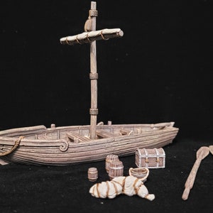May include: A miniature wooden pirate ship with a mast and sail, alongside barrels, a treasure chest, oars, and a wrapped bundle. The ship and accessories are in shades of brown and beige, creating a rustic, nautical theme.