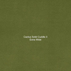 May include: Olive green fabric with the text "Cactus Solid Cuddle 3 Extra Wide" in white. The fabric has a soft, textured appearance, and the color is a muted, earthy tone.