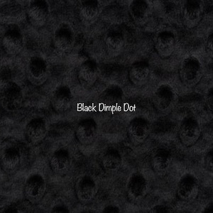 May include: Black fabric with a dimpled dot pattern. "Black Dimple Dot" is written in white text on the fabric.