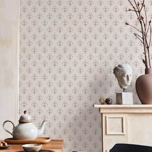 May include: A room with patterned wallpaper in a neutral colour. A wooden table is set with a teapot, dishes, and a bowl. A bust sculpture and vase with branches are on a mantelpiece.