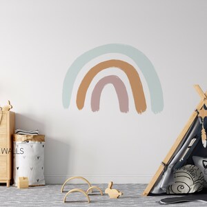 May include: A light blue, brown, and pink rainbow wall decal with a wooden teepee tent and a star-shaped dream catcher hanging from the top.