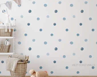 May include: A white wall with blue watercolor polka dots. The wall is decorated with a string of flags and a white bunny figurine on a shelf. The text "WEST COAST WALLS" is visible in the bottom right corner.