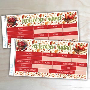 May include: Two rectangular budget planner stickers featuring a fall theme with autumn leaves, a basket of red apples, and a book with an apple on top. The text reads September Budget, Income, Totals, Expenses, Variable Expenses, and Fixed Expenses.