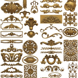 May include: A collection of ornate, gold-colored decorative elements, including medallions, floral designs, and scrollwork. The image showcases various shapes and sizes, suitable for embellishments or architectural details. The pieces have a detailed, textured appearance.