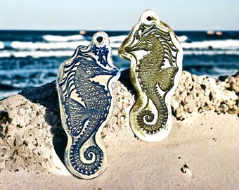 Pair of pottery sea horse ornaments for the beach lover